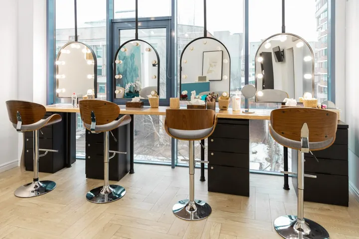 Modern hair salon interior with styling stations and mirrors