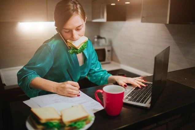 Busy Working women with a sandwich