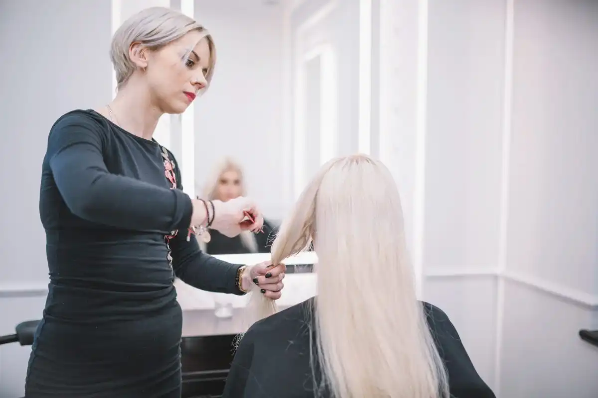 Stylist coloring a client's hair
